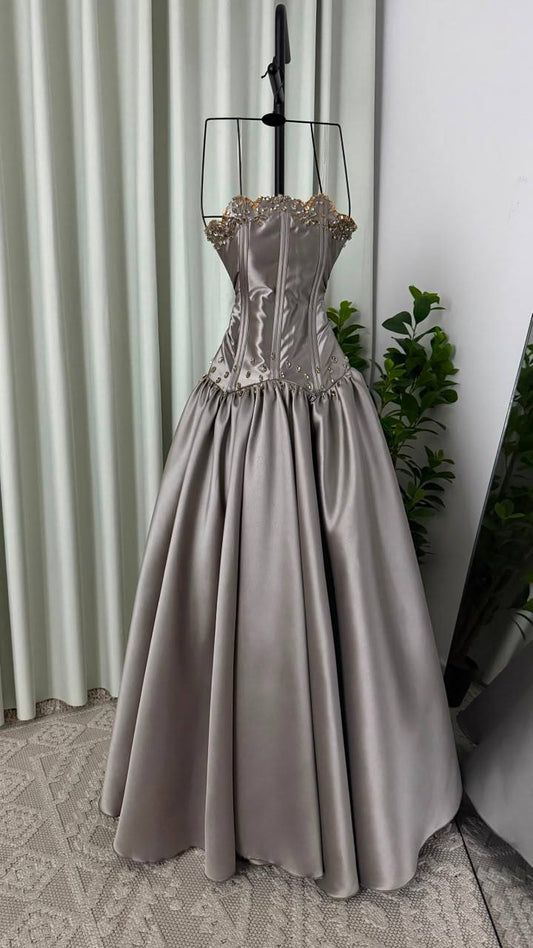 Elegant evening dress with a corset cut and metallic gray color