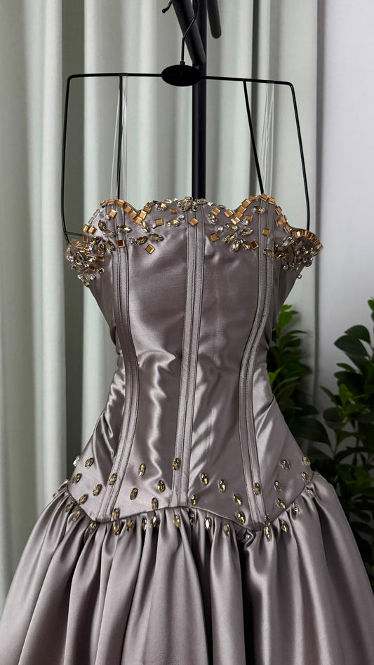 Elegant evening dress with a corset cut and metallic gray color